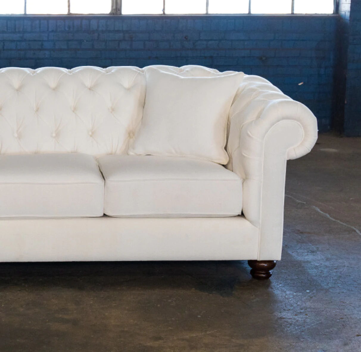 white tufted sofa