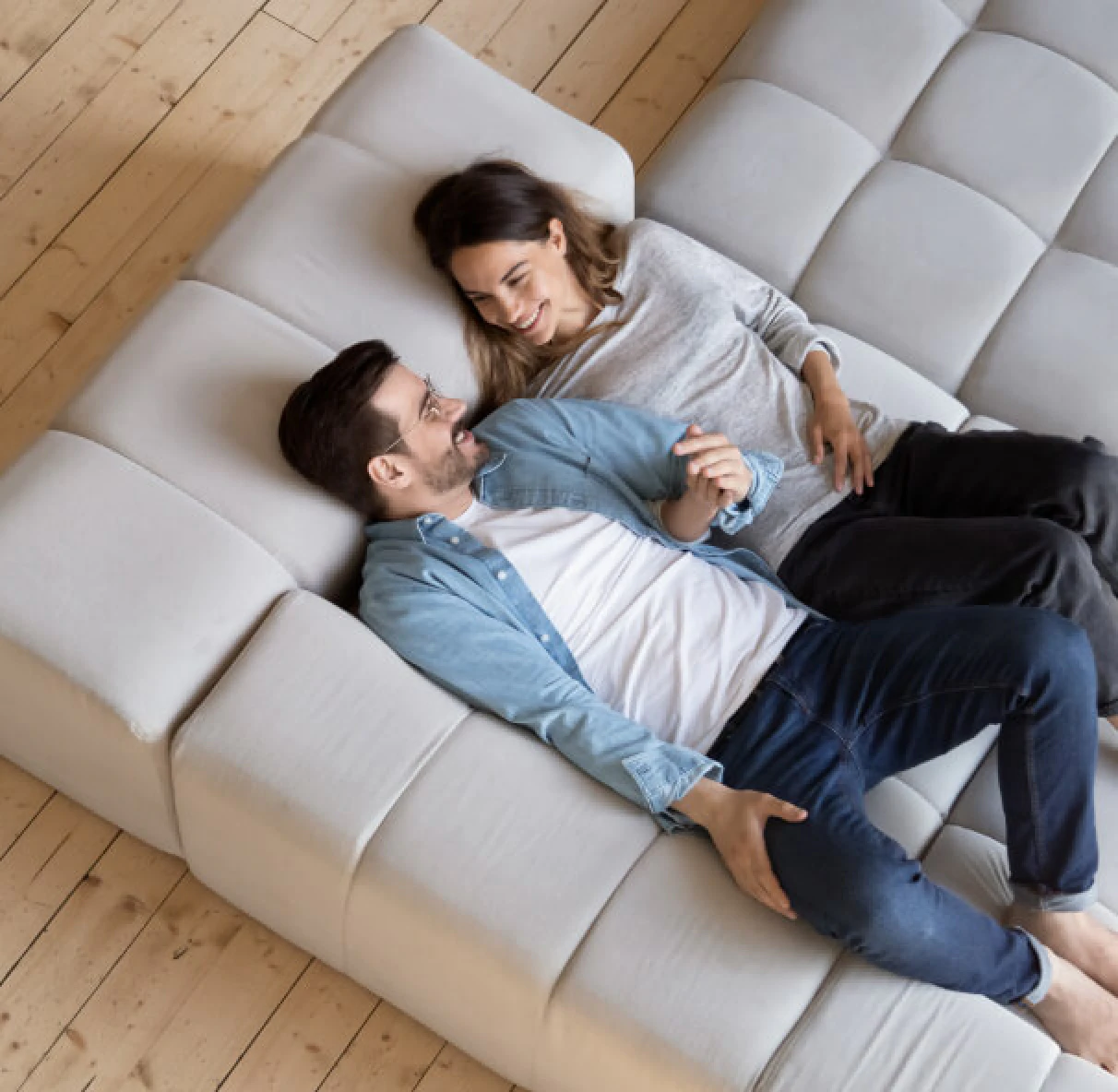 couple laying on sofa