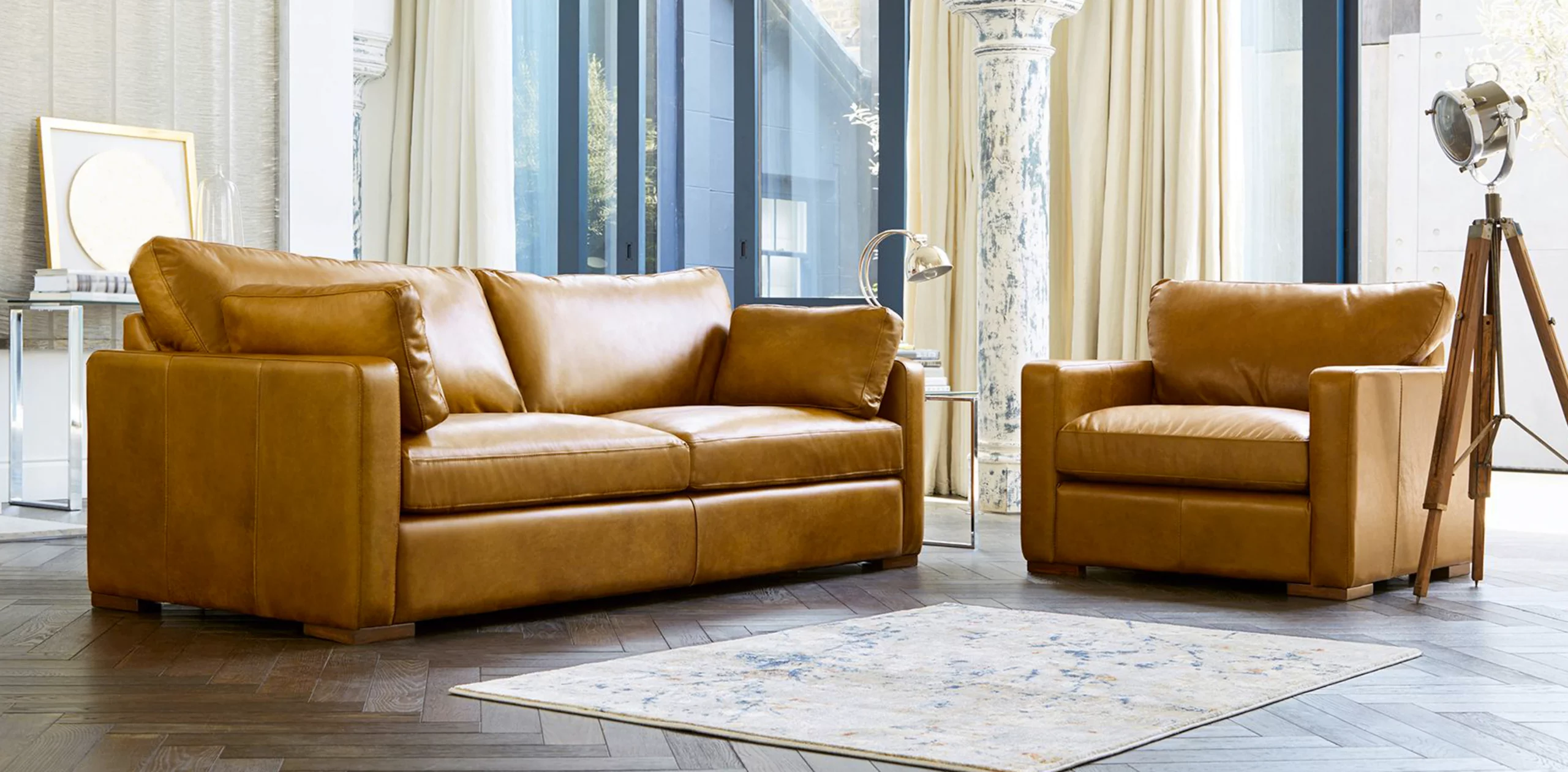 brown leather sofa and chair