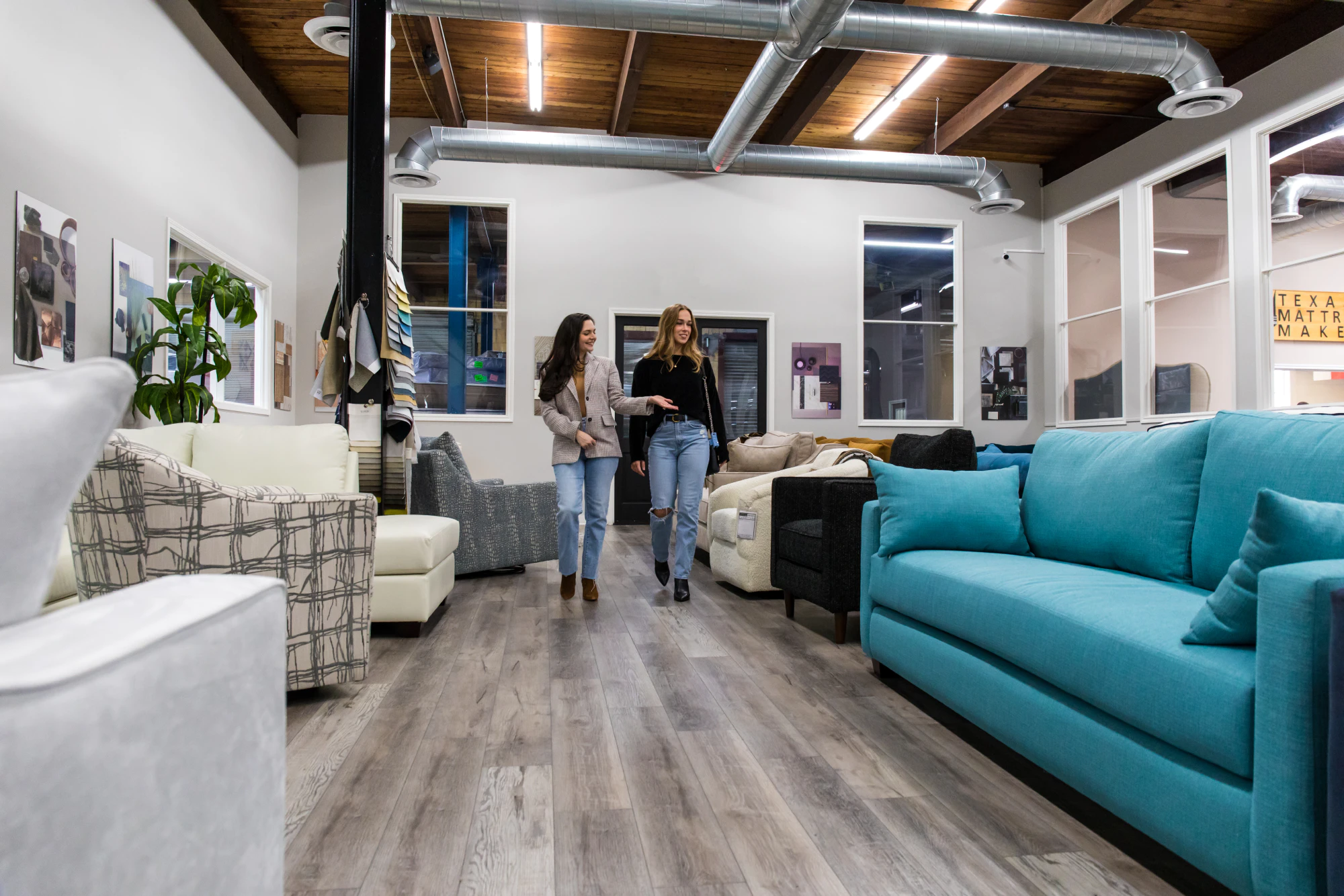 women walking through furniture showroom