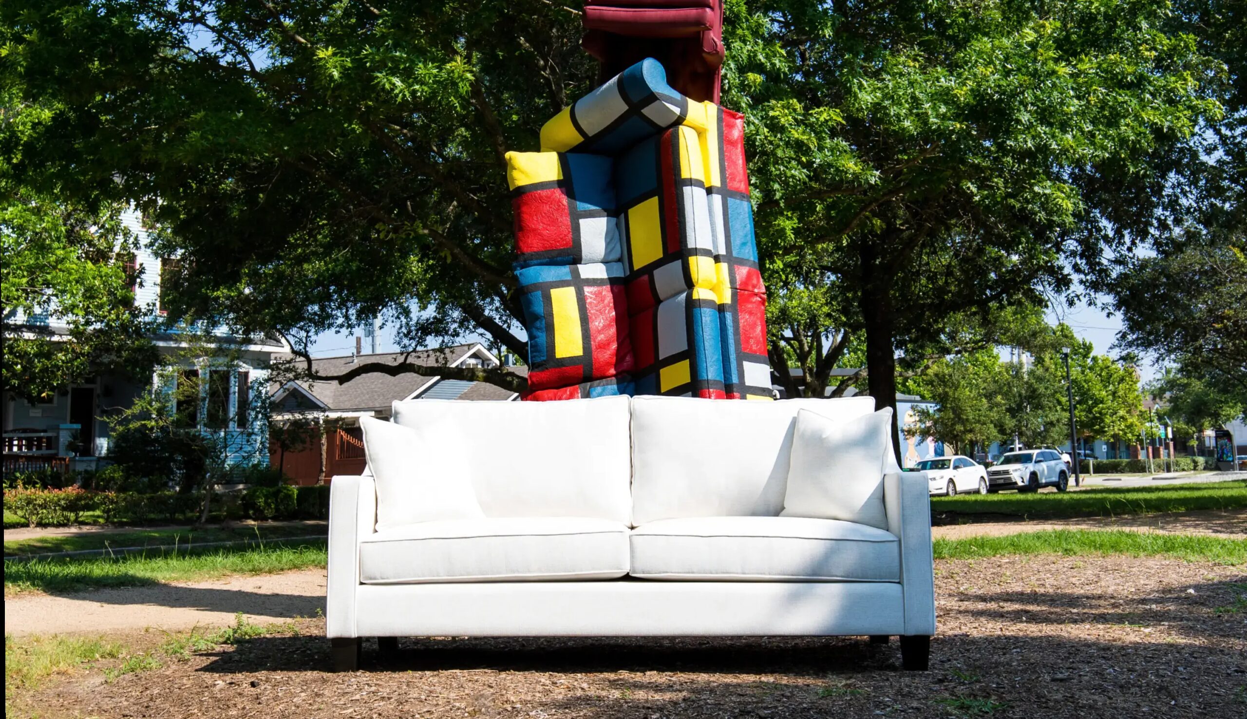 Heights couch in front of sculpture outside