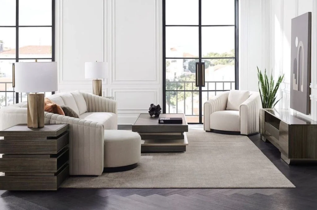 Living Designs Furniture created a custom white armchair with curved arms and channeled details.