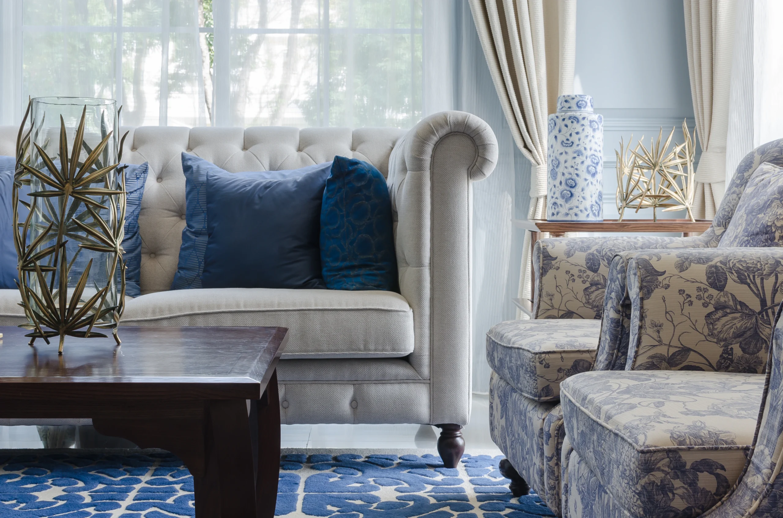 luxury living room with sofa on blue pattern carpet