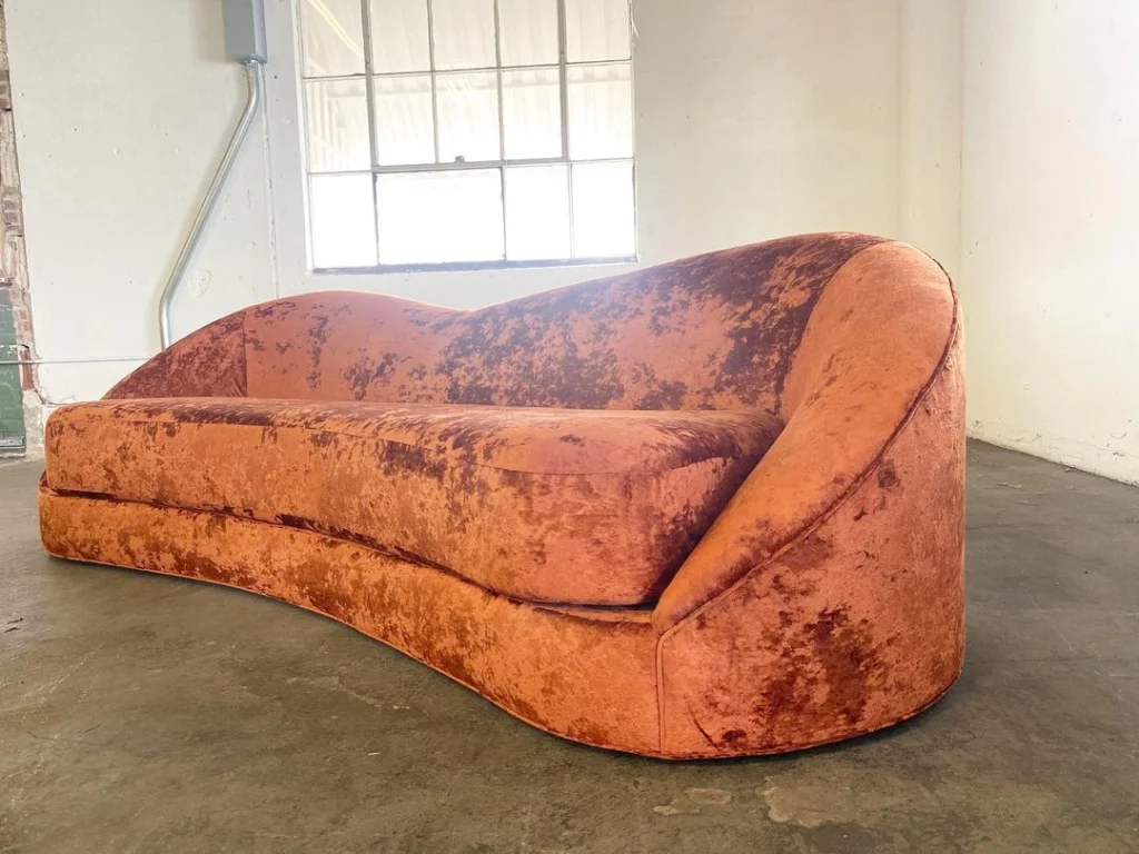 Custom burnt orange couch made by Living Designs Furniture.
