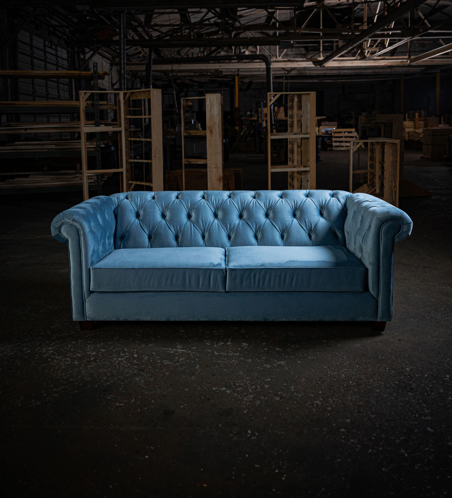 blue couch in a warehouse