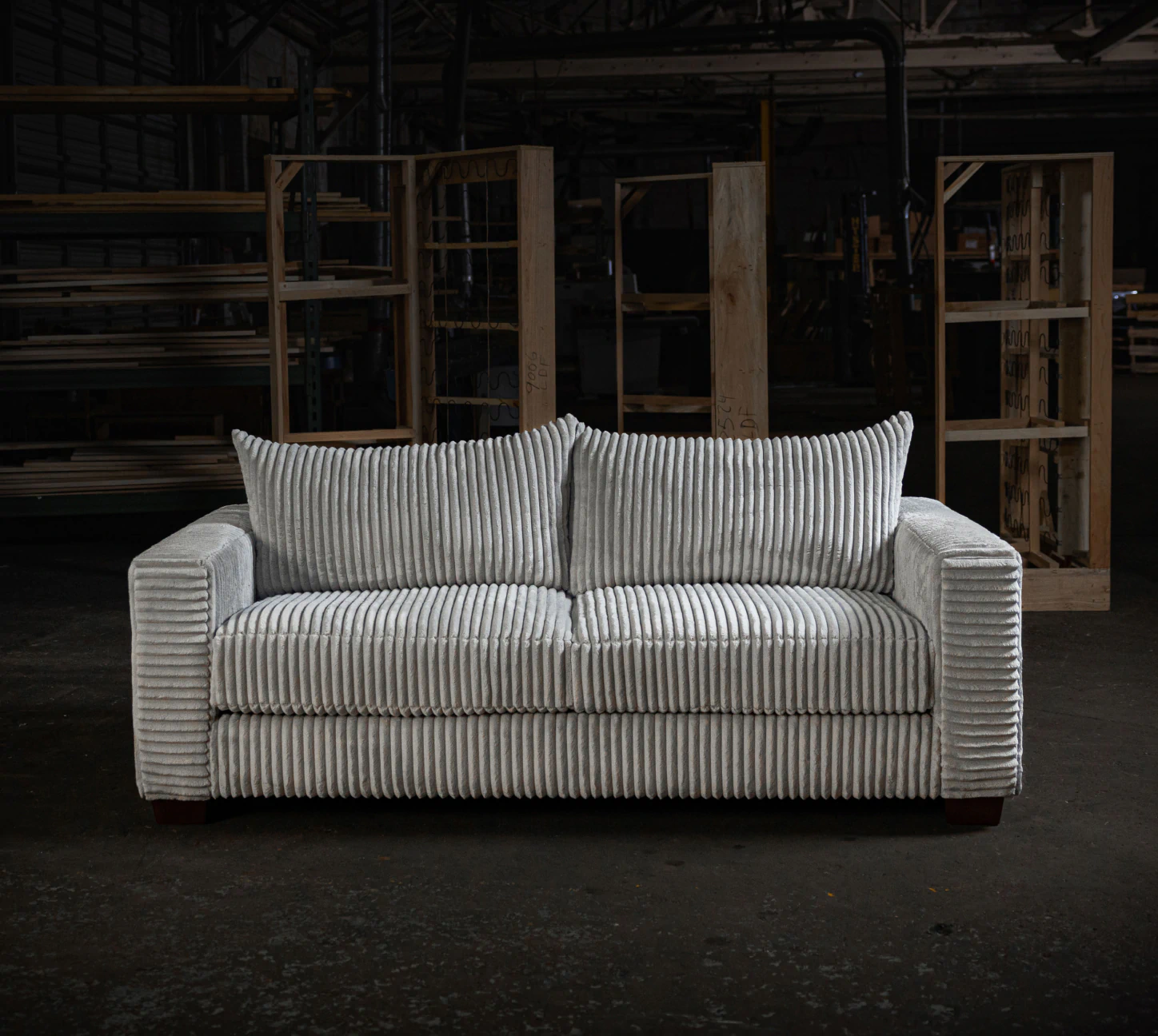 white couch in dark warehouse