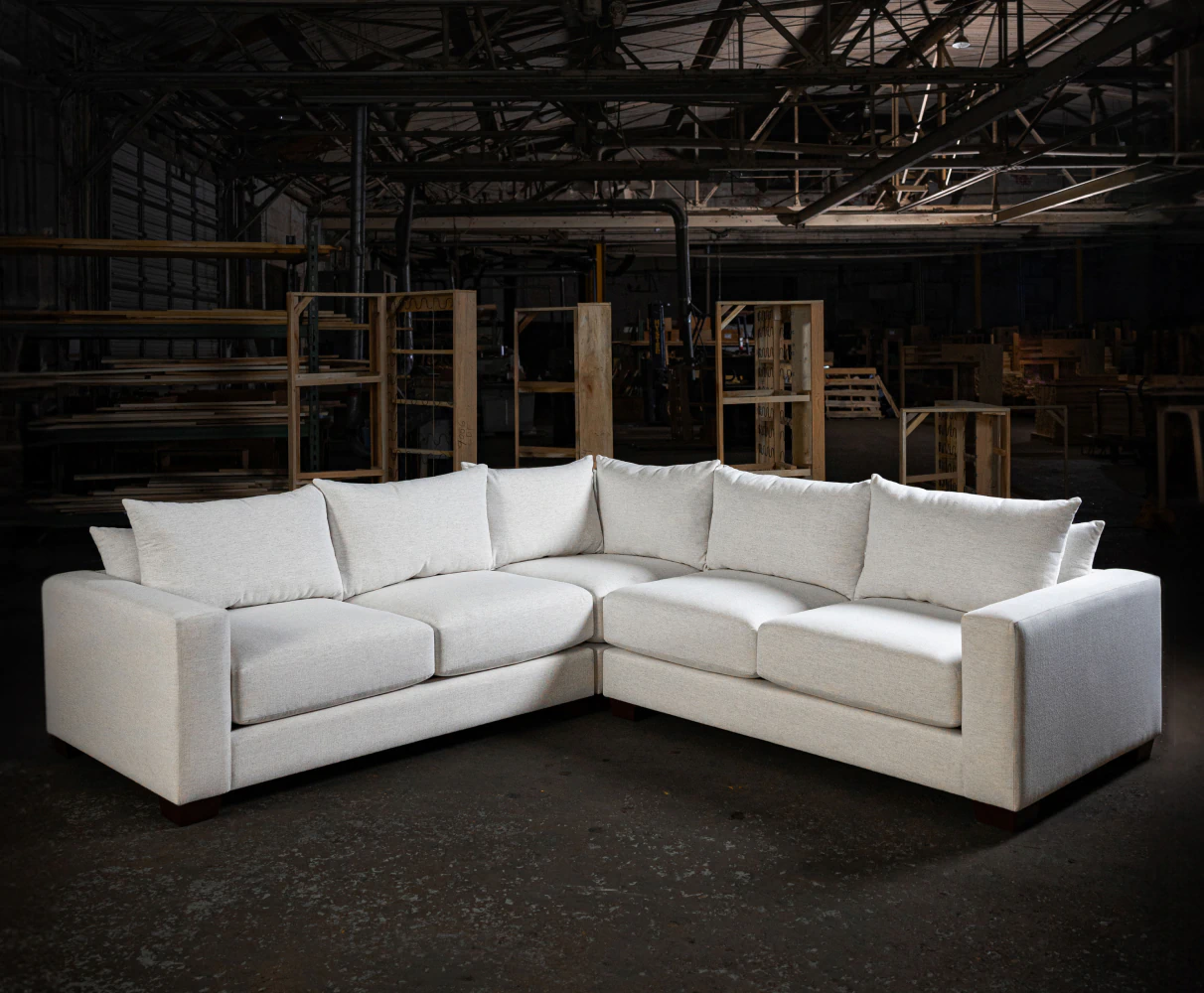 white sectional in a dark warehouse
