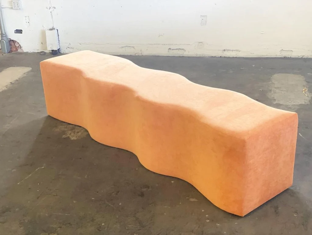 Light orange custom bench by Living Designs Furniture.