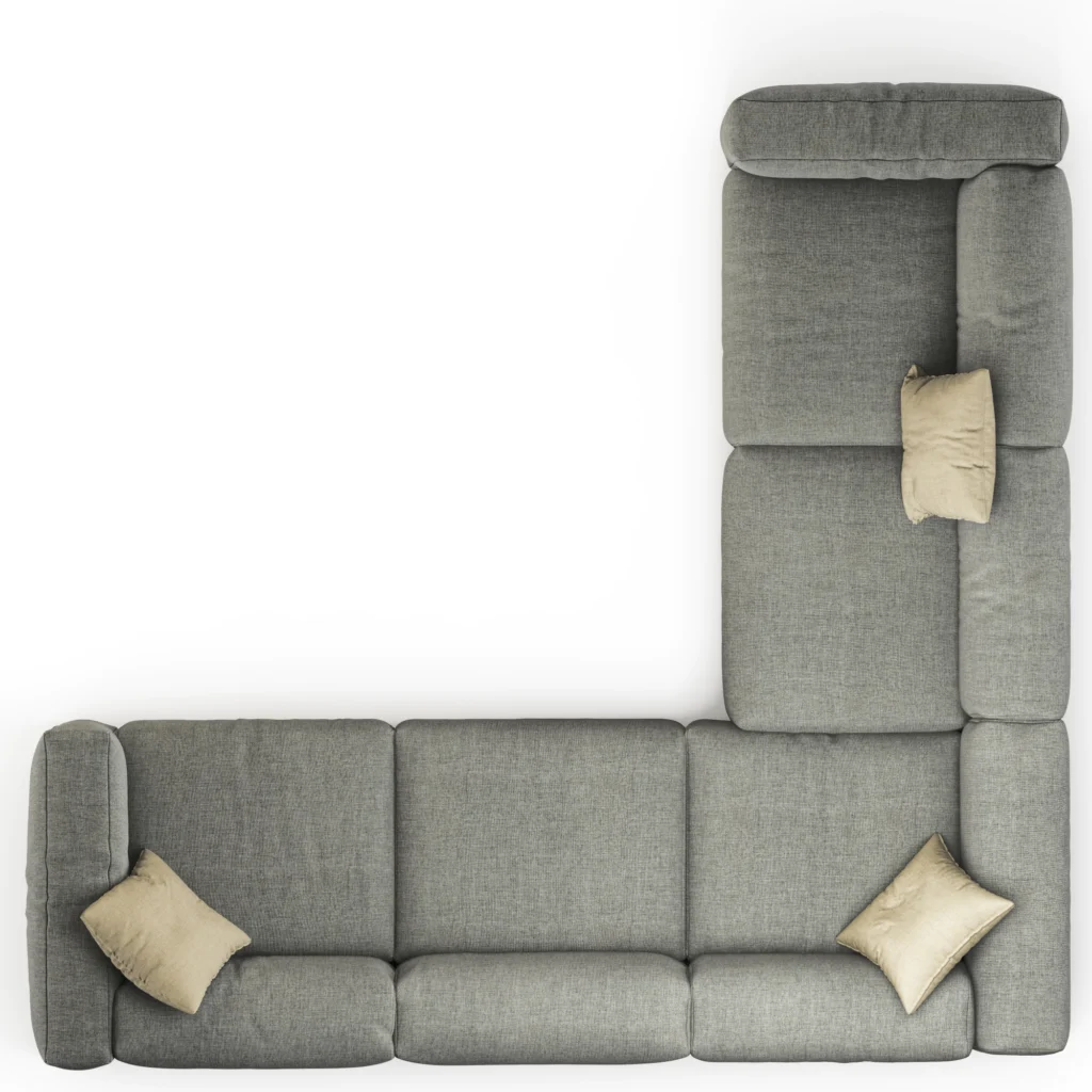 Gray L-shaped sectional with white pillows. 
