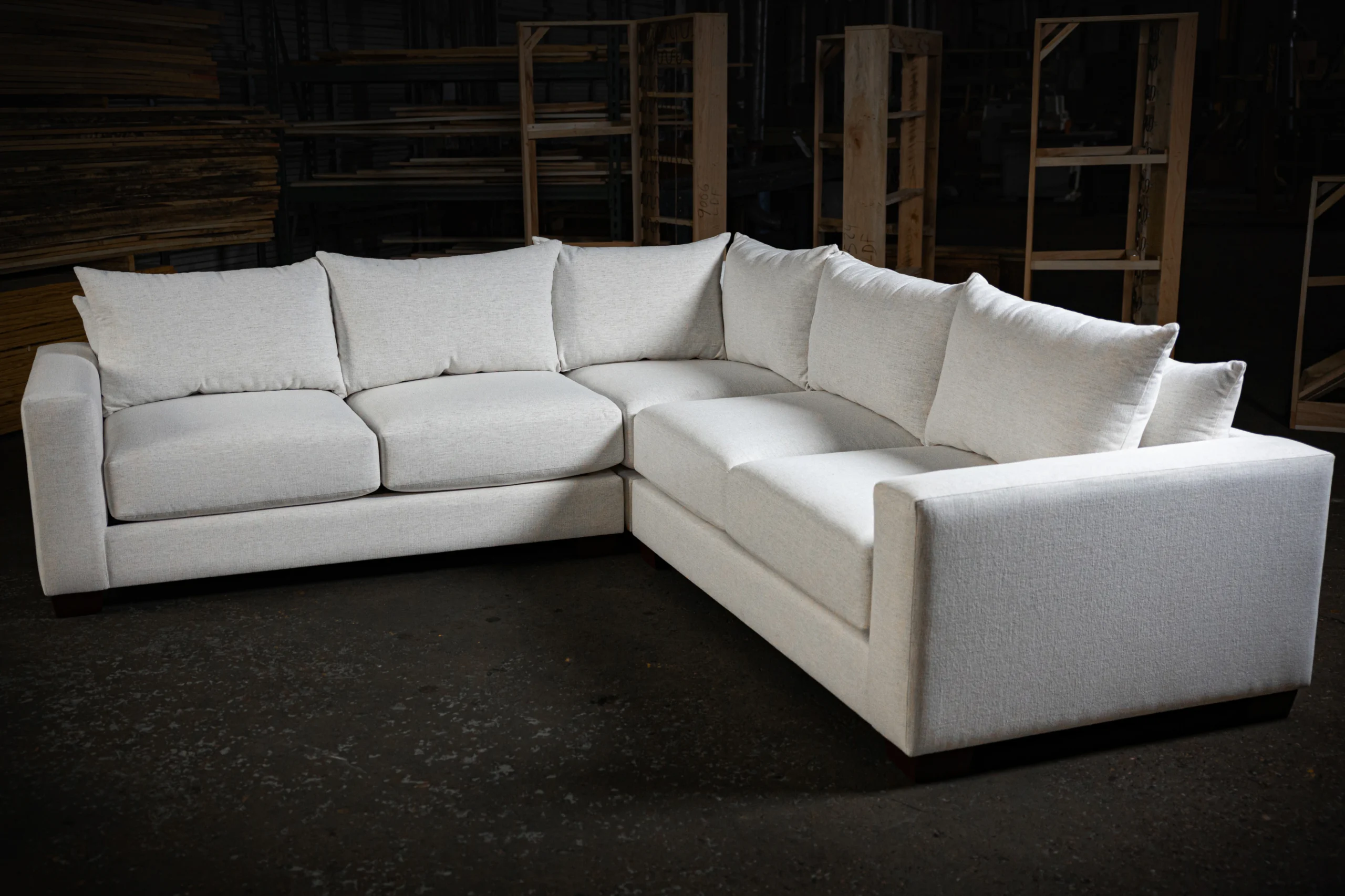 white sectional in a dark warehouse