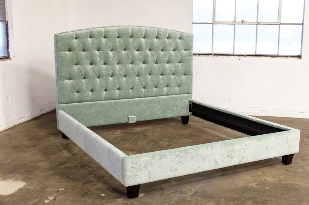 Light green crushed velvet bed frame with a tufted headboard. 