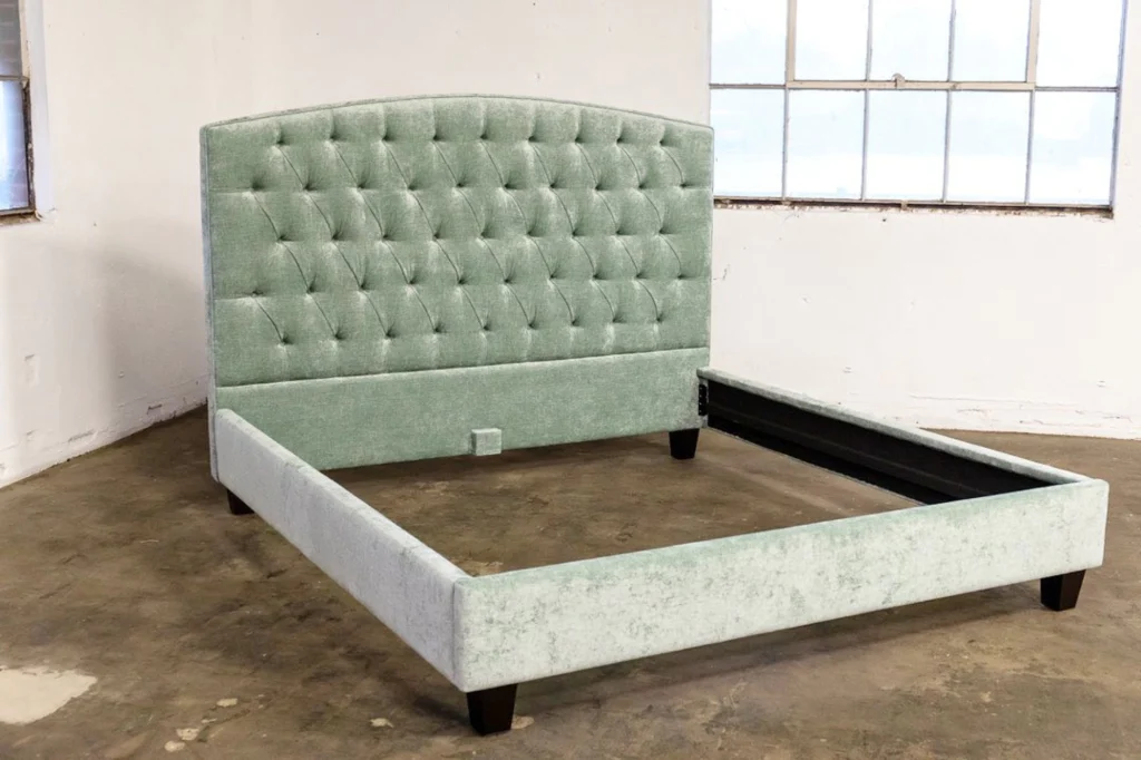 Light green crushed velvet bed frame with a tufted headboard.